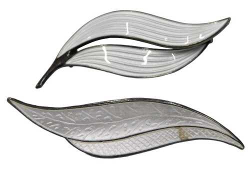 Two Norwegian enamel bar brooches, each formed as a leaf, with white enamel decoration, stamped...
