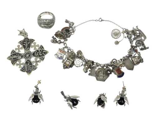 A group of assorted silver and other jewellery, comprising a silver charm bracelet, with enamel...