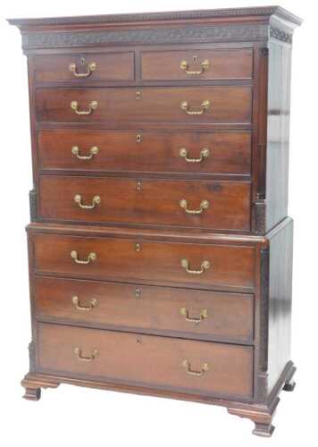 A George III mahogany chest on chest, the top with a moulded cornice above a blind fret frieze...