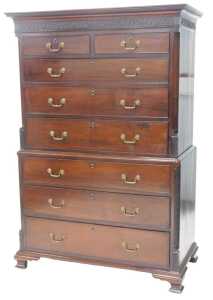 A George III mahogany chest on chest, the top with a moulded cornice above a blind fret frieze...