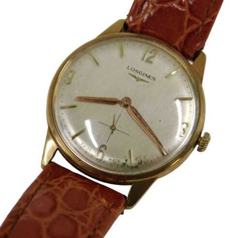 A Longines 9ct gold cased gent's wristwatch, with a silvered numeric and baton dial, with gold...