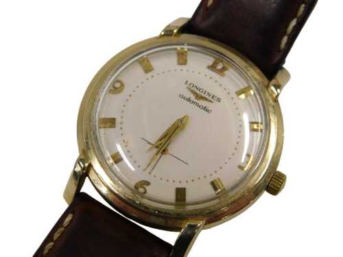 A Longines automatic gent's wristwatch, with a cream batoned and numeric dial, with automatic...