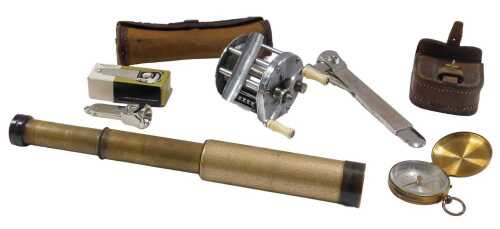 An early 20thC brass pocket compass, pocket telescope, cigar cutter, 15cm long, another, and a...