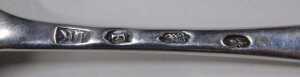 A matched pair of George III silver fiddle pattern serving spoons, each bearing crest with a... - 3