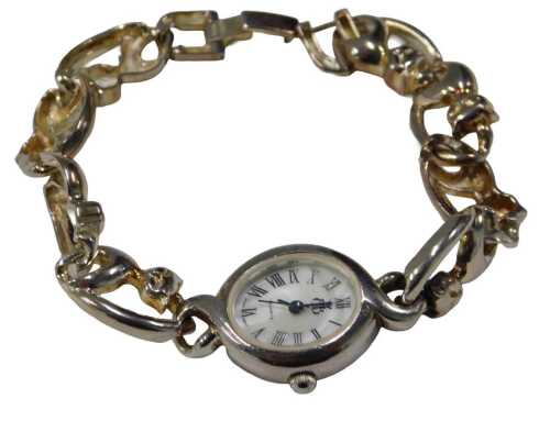 A Brooks & Bentley silver cat watch, the oval mother-of-pearl faced wristwatch head with four...