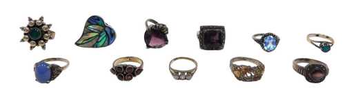 Eleven silver stone set dress rings, to include mother-of-pearl, opal, amethyst, and others,...