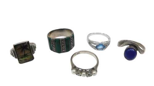 Five silver and other dress rings, to include a butterfly wing palm tree design dress ring,...