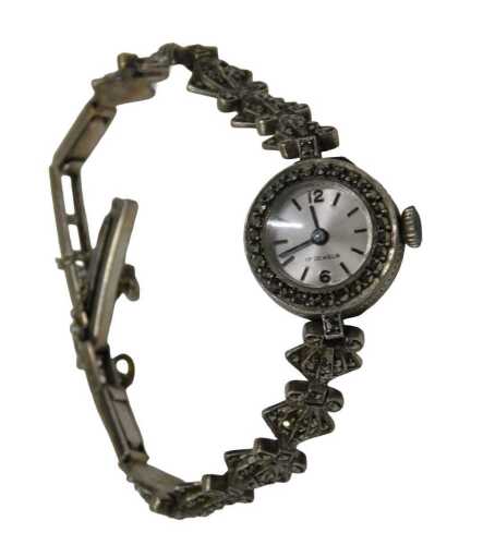 A marcasite ladies cocktail watch, the fan design bracelet with a silvered and baton dial, 1.5cm...