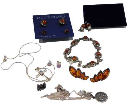 A group of imitation amber jewellery, comprising a pair of four layered stud earrings, a St...