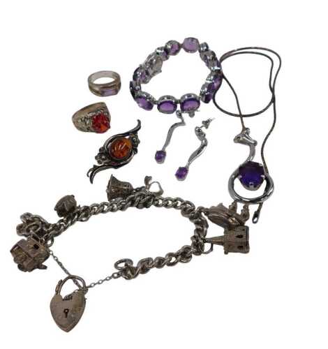 A group of silver and other assorted costume jewellery, comprising a silver curb link charm...