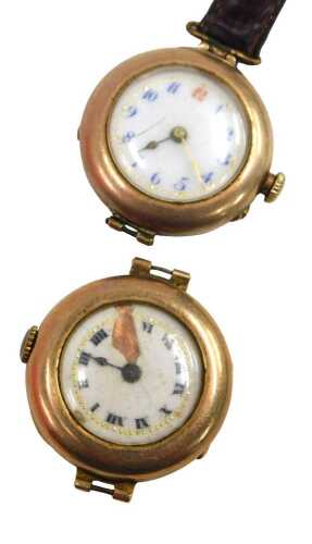 Two 9ct gold cased wristwatch heads, one on partial brown leather strap, 31.5g all in. (AF)