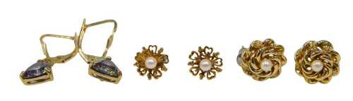 Three pairs of earrings, comprising a pair of mythical stone trilink cut drop earrings, with...