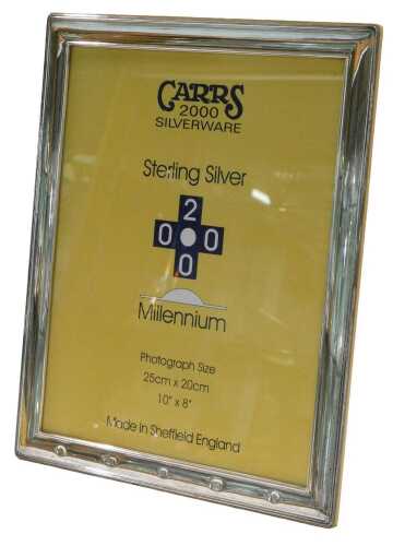An Elizabeth II silver frame, by Carrs, of plain rectangular form, light wood easel back,...
