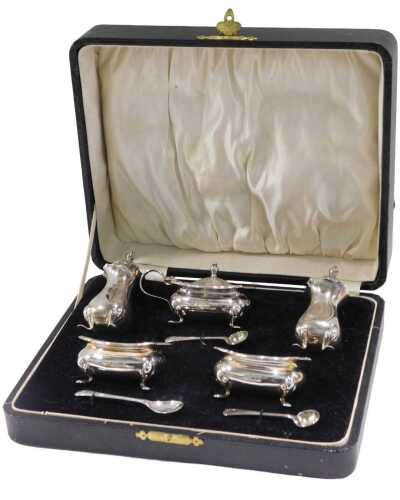A George V silver five piece cruet set, by William Suckling Limited, comprising a pair of pepper...