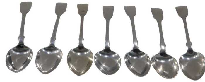 A matched set of seven silver fiddle pattern dessert spoons, four London 1841 and three London...