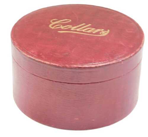 An early 20thC red leather collar box, with gilt stencilling, 19cm diameter.