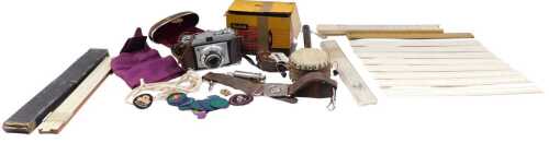 Cameras, a Kodak Retinette camera in brown case, 8cm high, a slide rule, various other rulers,...