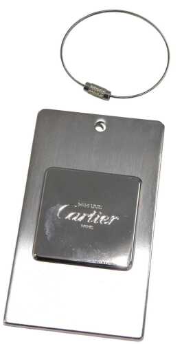 A Must de Cartier Share the Spirit luggage label, 10cm high, boxed.