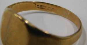 A 9ct gold signet ring, the rectangular ring head bearing rubbed initials, ring size X&frac12;, 5.6g. - 2
