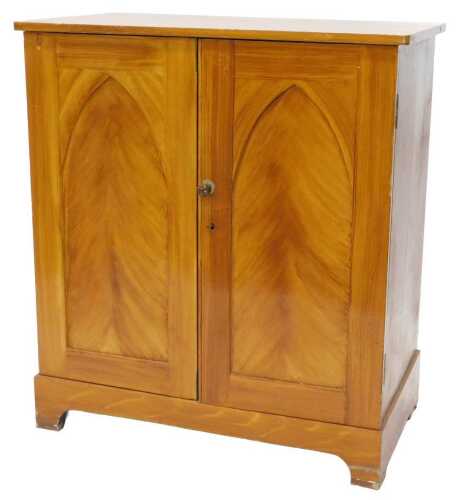 An early 20thC painted pine specimen cabinet, the drawers of differing sizes, fronted by...
