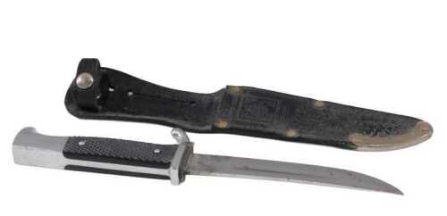 A Linder Messer Solingen Whitby dagger, with shaped blade, turned handle and chrome hilt, with...