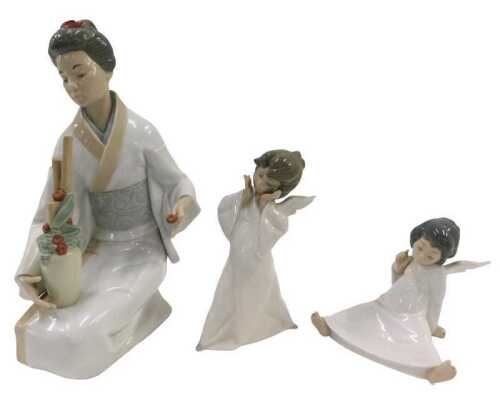 A Nao figure group Geisha, 33cm high, boxed, a further Nao figure and a Nao seated angel. (3)