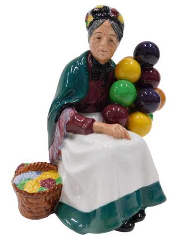 A Royal Doulton figure The Old Balloon Seller, HN1315, 22cm high, boxed.