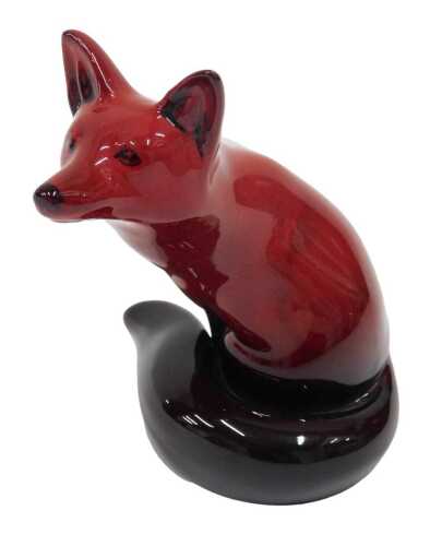 A Royal Doulton flambe figure seated fox, 12cm high.