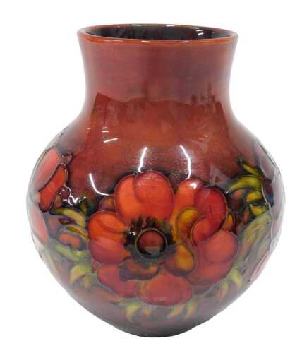 An early 20thC William Moorcroft flambe vase, Anemone pattern, blue signature mark beneath, 19cm...