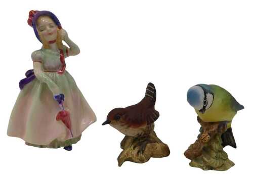 An early Royal Doulton figure Babie, HN1679, 12cm high, and two Beswick matte birds, Blue tit...