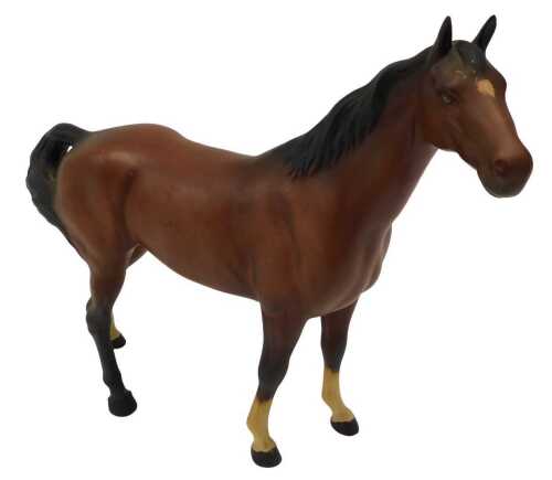 A Beswick standing matte finish horse, in brown colourway, 22cm high.