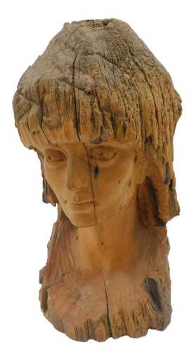 A 20thC carved studio driftwood figure of a lady, quarter profile, 54cm high.