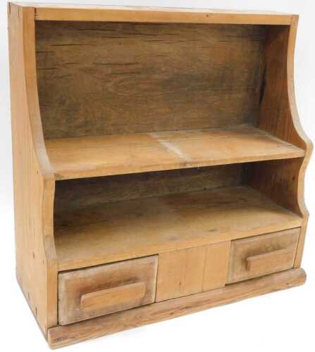 An early 20thC hanging pine spice rack, with two open shelves above two drawers beneath, 42cm...