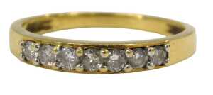 An 18ct gold diamond half hoop dress ring, set with seven round brilliant cut diamonds, each...