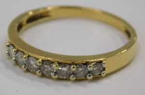 An 18ct gold diamond half hoop dress ring, set with seven round brilliant cut diamonds, each... - 2