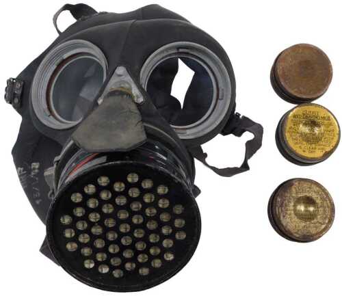 A WWII respiratory gas mask, with metal fittings, 1943, 26cm high.