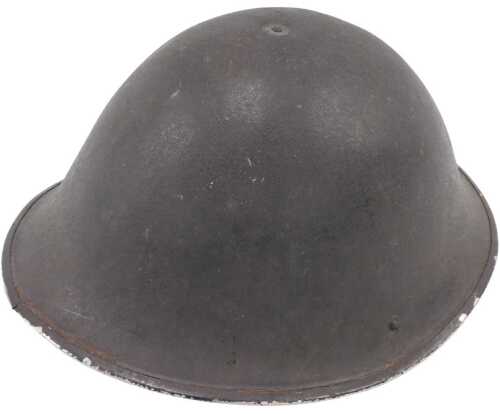 A 20thC British post WW2 army helmet, with original liner and green hessian chin strap, 18cm high.