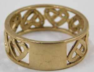 A 9ct gold eternity ring, of pierced heart design, half set with diamonds totalling 0.05ct, ring... - 3
