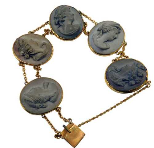 A mid 20thC molten lava cameo style bracelet, each formed as five panels with females, in a...