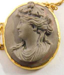 A mid 20thC molten lava cameo style bracelet, each formed as five panels with females, in a... - 2