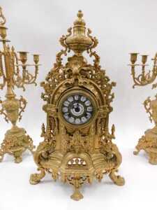 A 20thC gilt metal clock garniture, the 9cm diameter raised enamel Roman numeric dial housed in... - 5