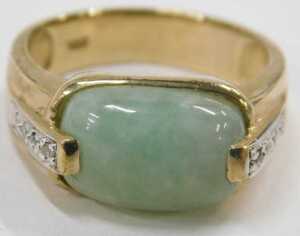 A 9ct gold jade and diamond dress ring, the oblong pale jade, with four tiny diamond set... - 2