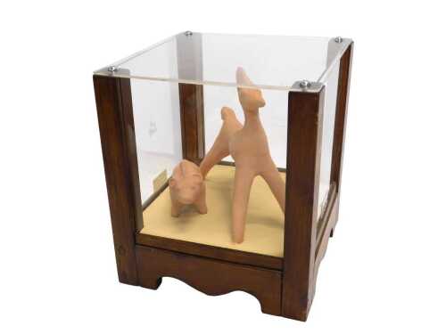 A terracotta model of decorative Greek toy animals, in a pine and Perspex display case, 31cm...
