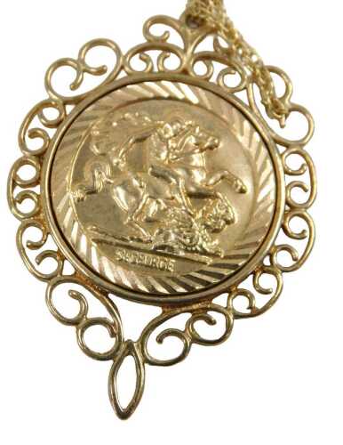 A 9ct gold St George and the Dragon pendant and chain, the 9ct gold framed pendant, on a fine...