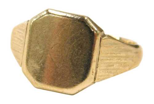 A 9ct gold signet ring, the octagonal panel with rubbed initials, and rubbed shoulders,...
