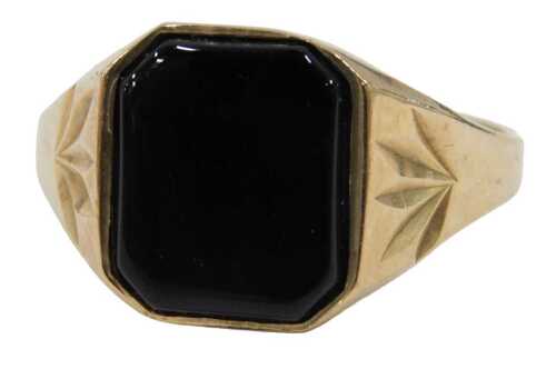 A 9ct gold signet ring, set with polished black onyx, rectangular cut, with star etched...