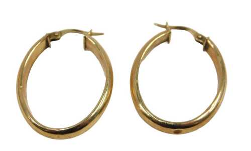 A pair of hoop earrings, each of oval plain design, with hinged clasp, yellow metal stamped 375,...