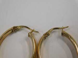 A pair of hoop earrings, each of oval plain design, with hinged clasp, yellow metal stamped 375,... - 2