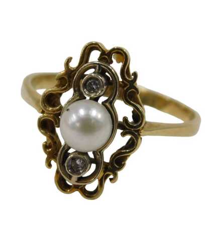 A pearl and diamond dress ring, the central pearl flanked by two tiny diamonds in a platinum Art...