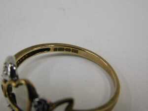 A 9ct gold dress ring, with heart and leaf pierced design, set with CZs in illusion setting,... - 2